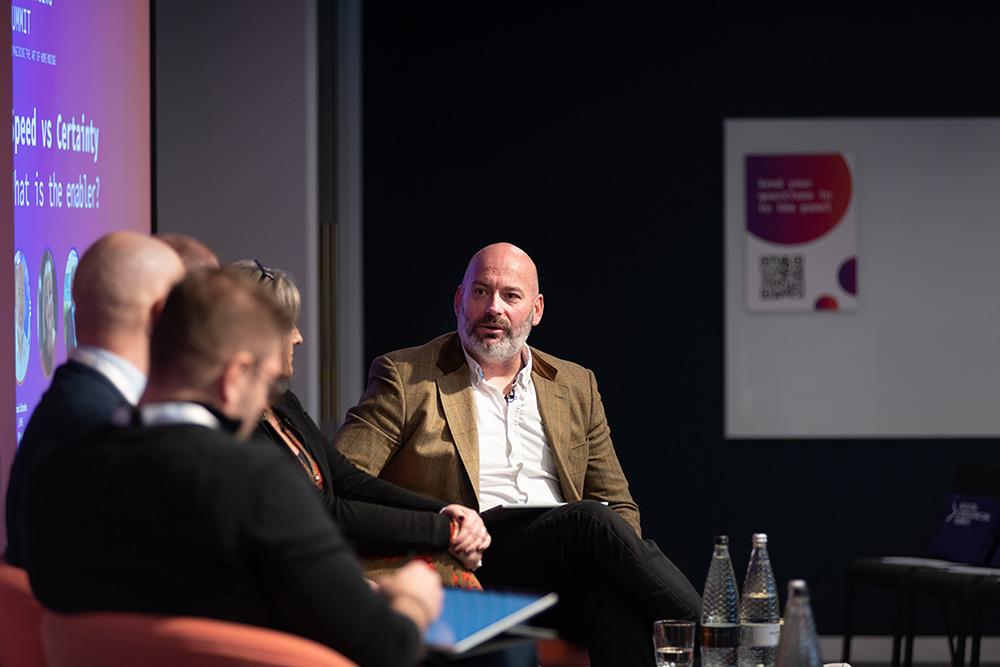 Travis Scholes chairing the panel at the Digital Conveyancing Summit 2023